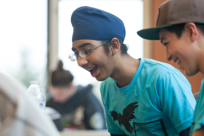 Two students smiling