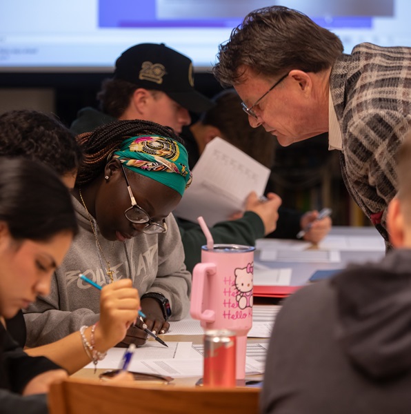 Students and a professor busy at work