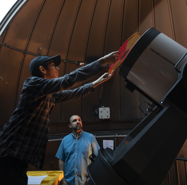 Physics professor Sean O’Neill and summer research students Julian and Jessica mount a 3D printed filter to the telescope in the W.M. Keck Observatory to ensure focusing accuracy as the group studies star clusters and variable stars