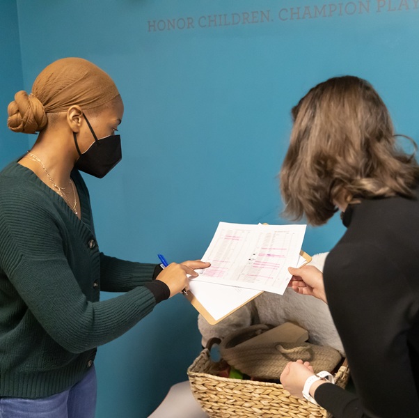 Student and professor looking at a paper