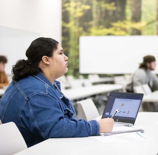 A student listening to a lecture in class