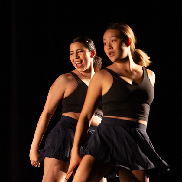 Two students dancing