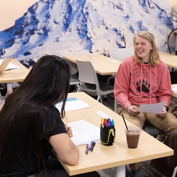 Students chatting in a classroom