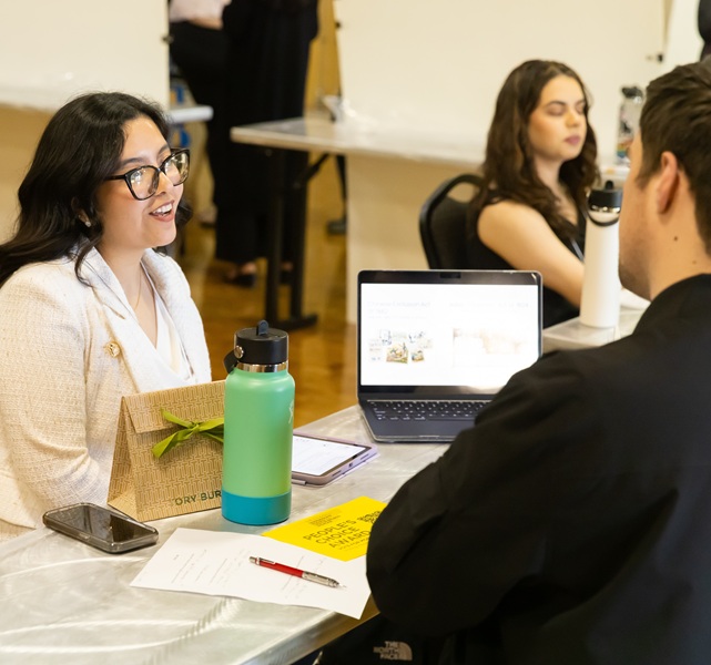 Students sitting at the table during The annual Dr. Rae Linda Brown Undergraduate Research and Creative Projects Showcase, Friday