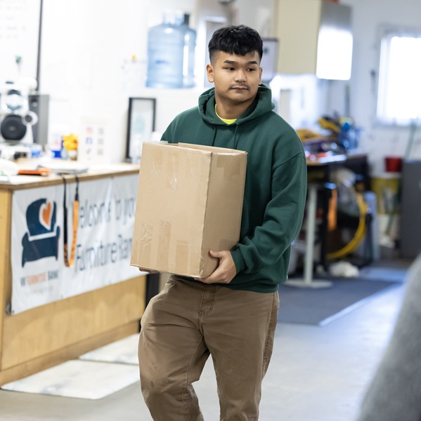 Student carrying a box