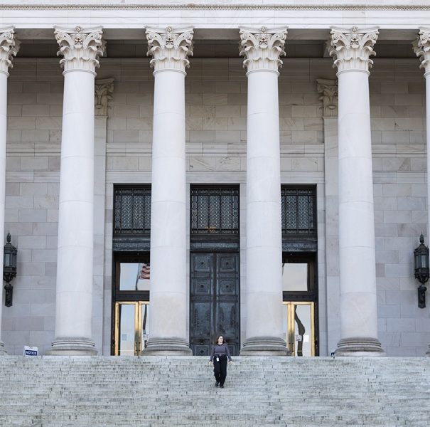 A student in front of the Capitol