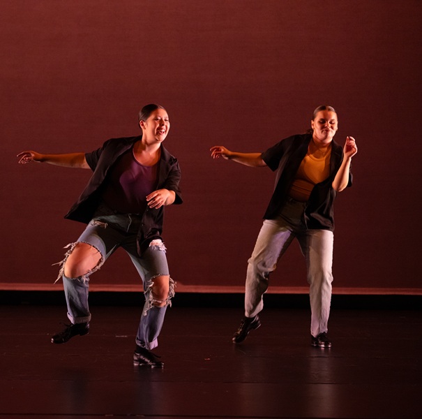 Two students performing a tap dance