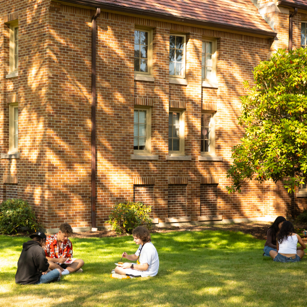 Students studying in the summer outside of Xavier