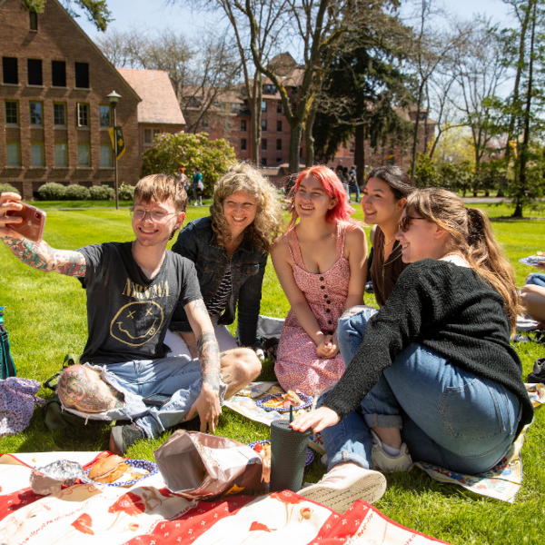 students taking selfie at red square