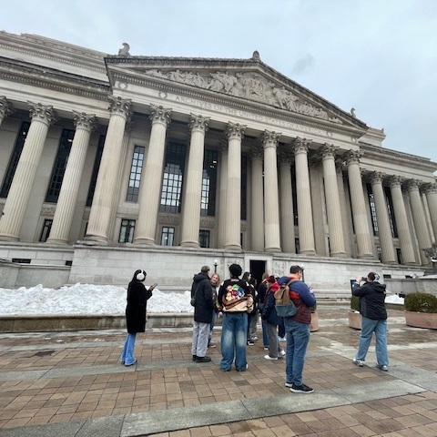 Students in a tour in front of the Capitol