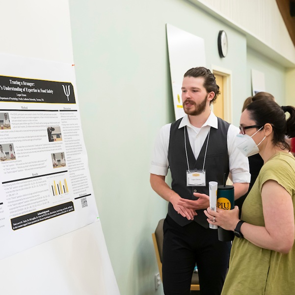 Student with his research project