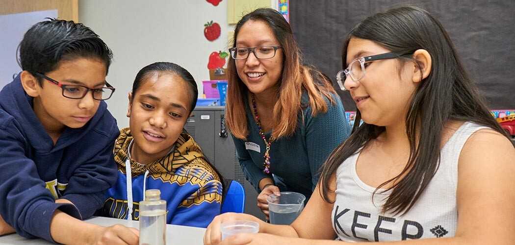 PLU students Jimmy Aung and Jamie Escobar leading a science class at Four Heroes Elementary as they explore the education through a grant funded program, Wednesday, April 17, 2019. (Photo/John Froschauer)