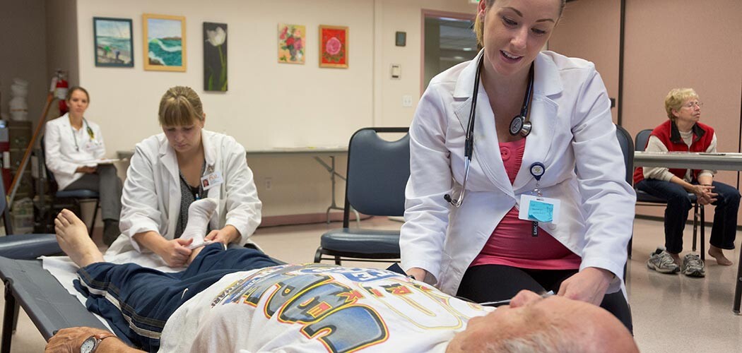 PLU Nurse Practitioner students working in a clinic at the Sumner Senior Center on Thursday, Sept. 25, 2014. (Photo/John Froschauer)