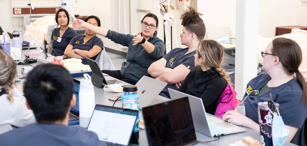 PLU faculty give instruction to nursing students during clinical practicum.