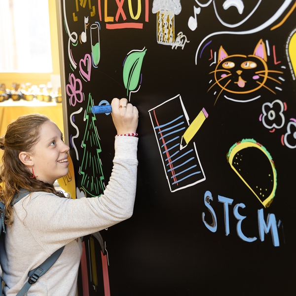 Student writing on a board