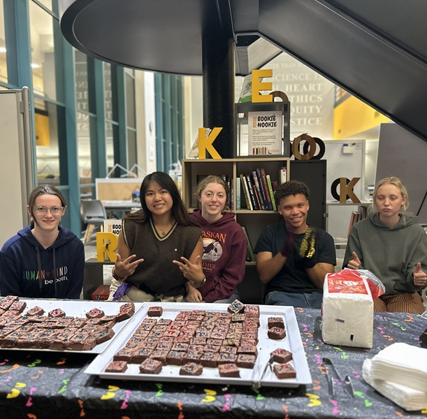 Students in Rieke Science center at a bake sale