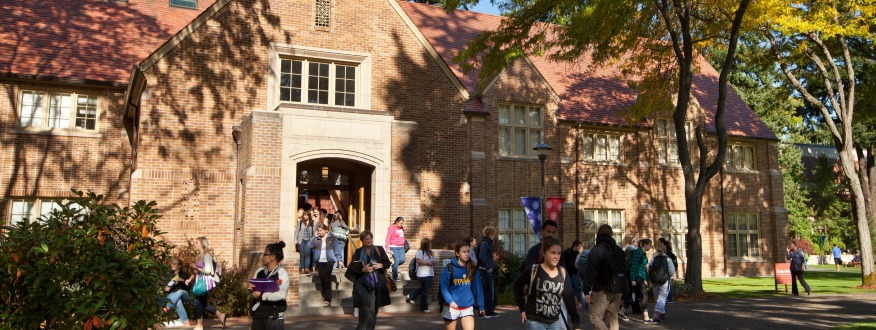 Xavier Hall with students coming out of the building