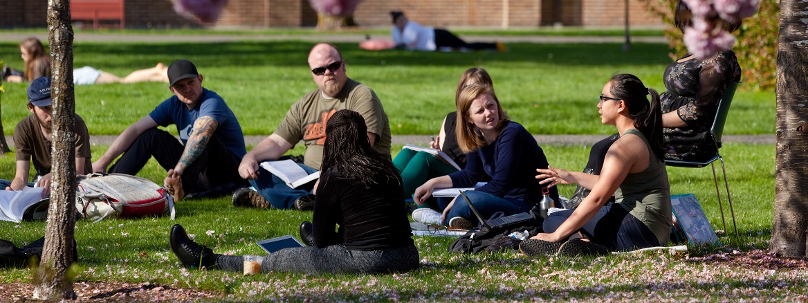 Class being held in the sunshine on upper campus