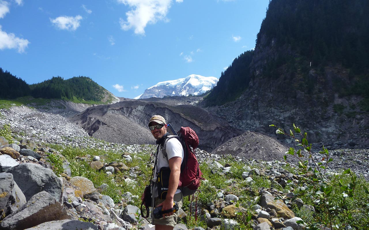Hking up through a glacial path on Mount Rainier.