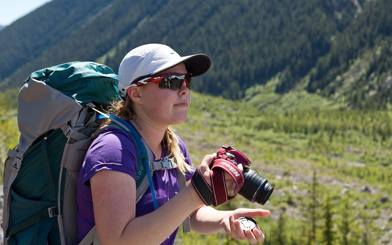 A PLU student taking photos on Mount Rainier.