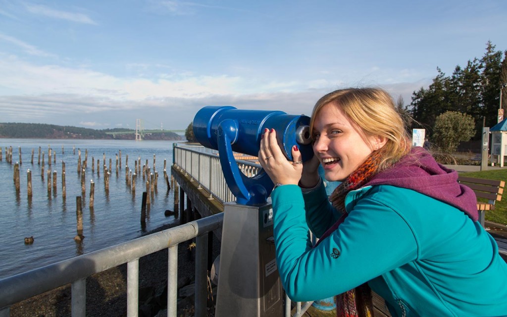 A PLU student checks out the view from Titlow Beach in Tacoma, Wash.