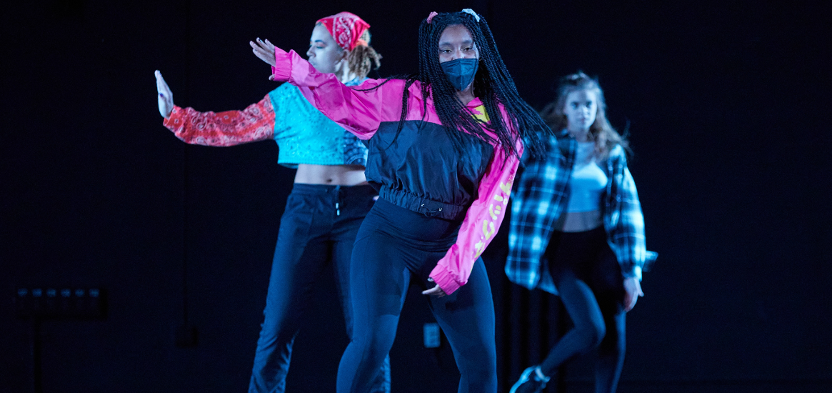 Three students performing a student-choreographed Hip Hop piece in Dance 2022 in Eastvold Auditorium