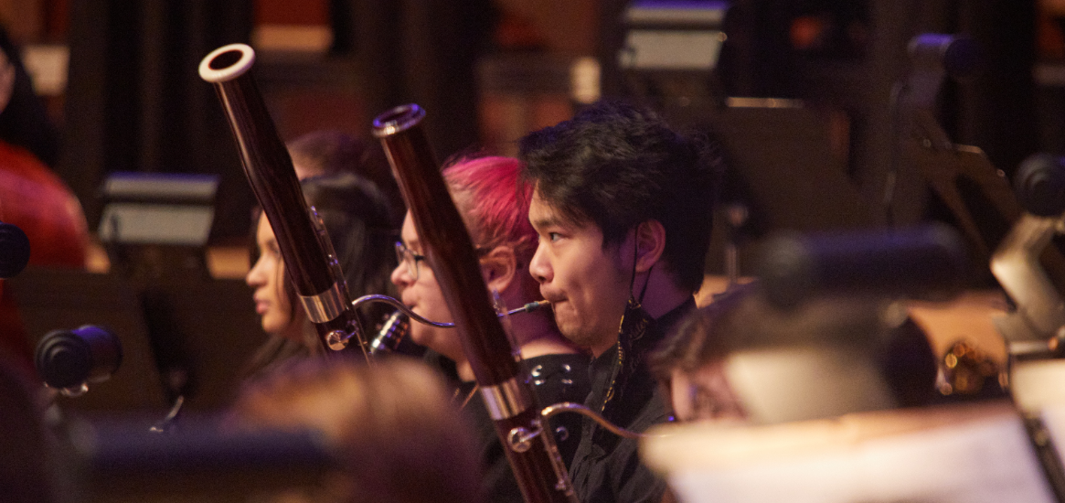 Focused image of a student playing bassoon in PLU Chamber Orchestra