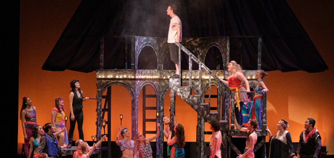 Cast of Pippin during the finale watching Pippin about to jump off of the stairs into the fire.