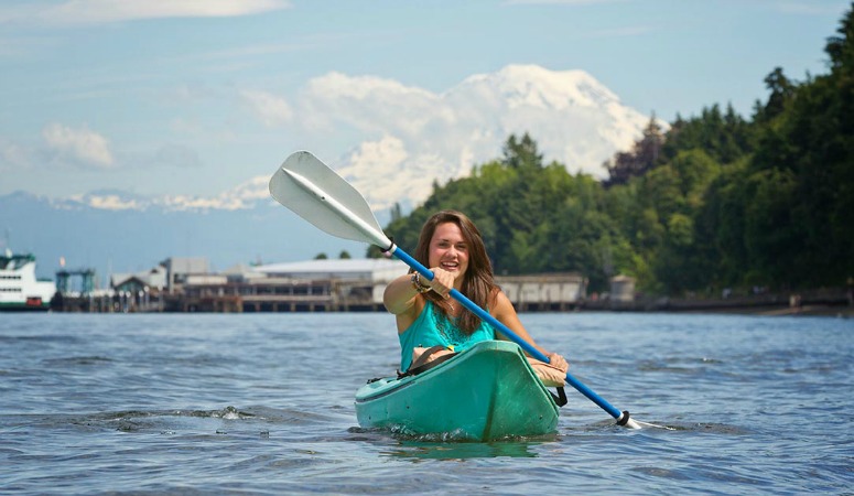 student kayaking