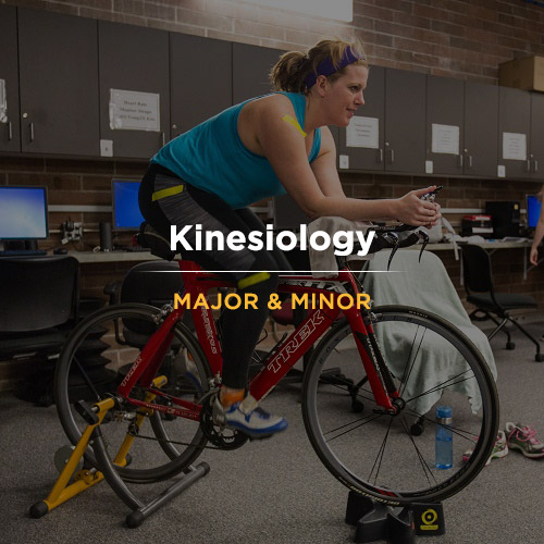 A woman riding a stationary bike in a room