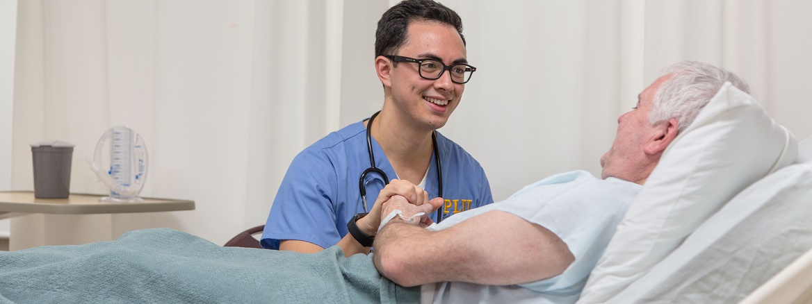 Nursing students Derek Quan and Jed Gosnell in the PLU nursing lab on Wednesday, Feb. 17, 2016. (Photo: John Froschauer/PLU)