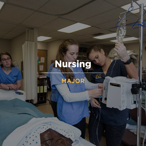 PLU Nursing students using a machine