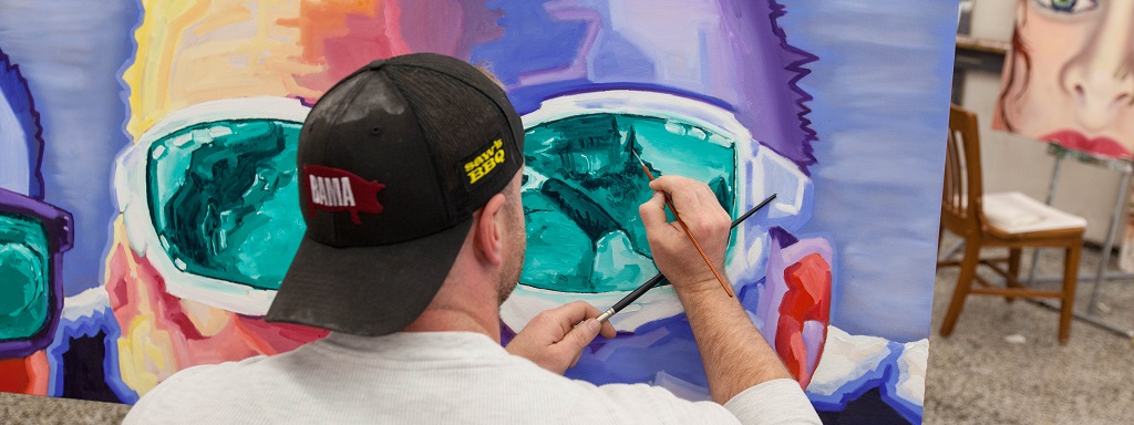 Students painting at PLU on Tuesday, May 24, 2016. (Photo: John Froschauer/PLU)