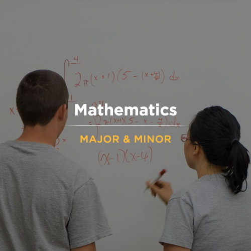 Two students solve a math problem at PLU on Thursday, May 5, 2016. (Photo: John Froschauer/PLU)