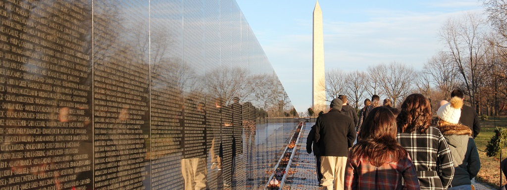 Students walk along the Vietnam Memorial with the National Monument in the background. Photo by student Anna Jessen.