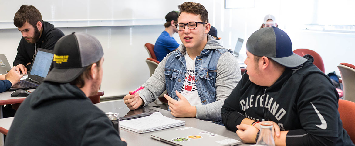 Justin Martinez '22 sits in a PLUS 100 course with his first-year football teammates. The first-year football player-only cohort is the first of its kind at PLU, a push by head coach Brant McAdams to support new student-athletes on and off the field.