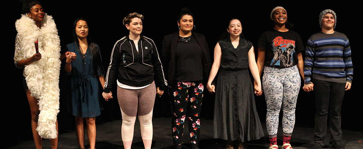 The cast of "Spectrums of Color" takes a curtain call after a performance.