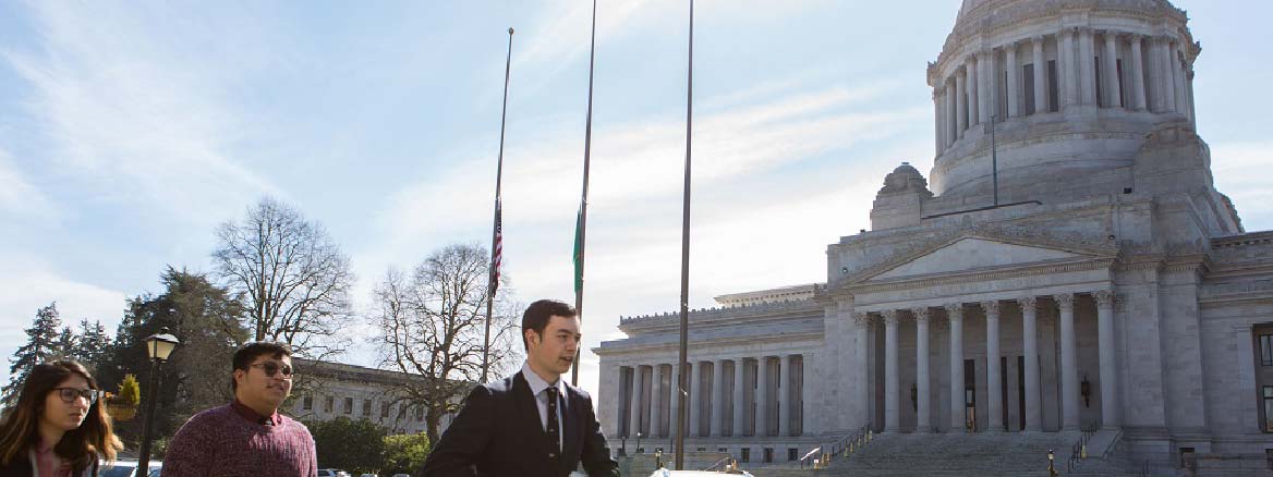 Student speaks in front of Washington State Capitol.