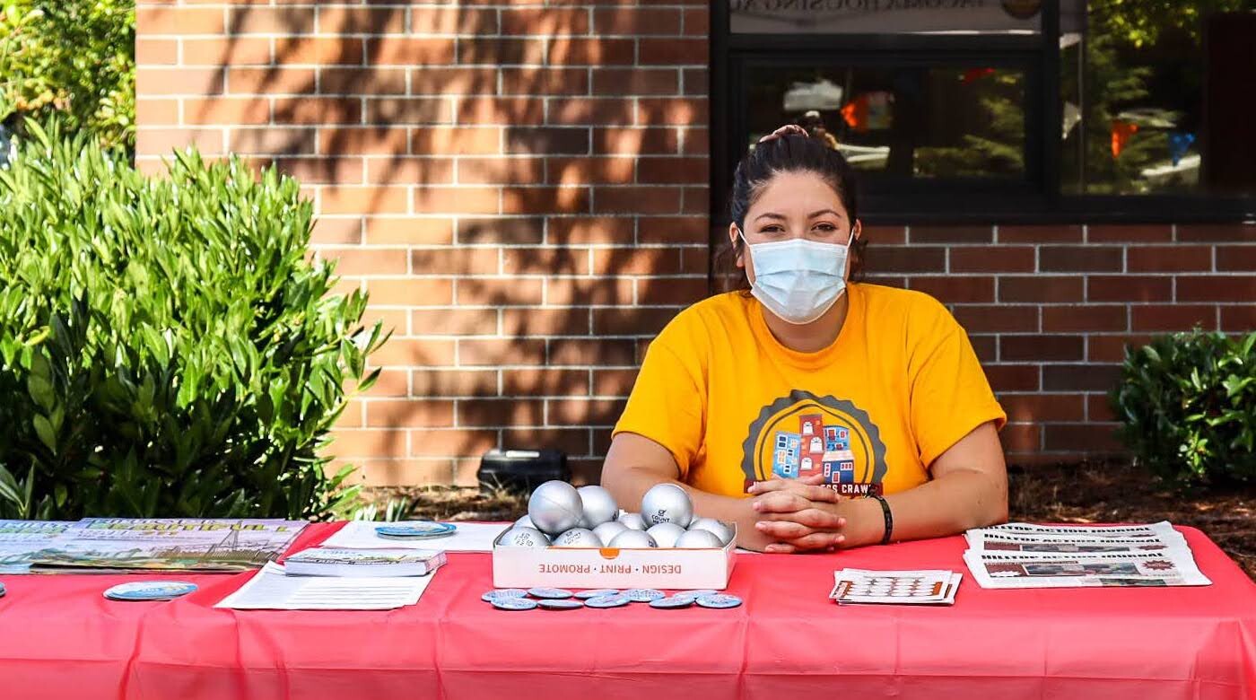 Gurjot Kang tabling for the Tacoma housing authority at a community event