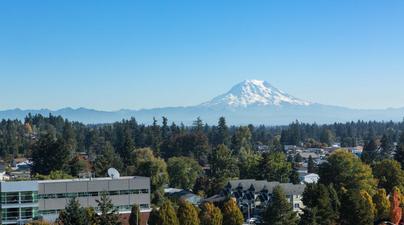 View of PLU campus from above with Mount Rainier in the background.