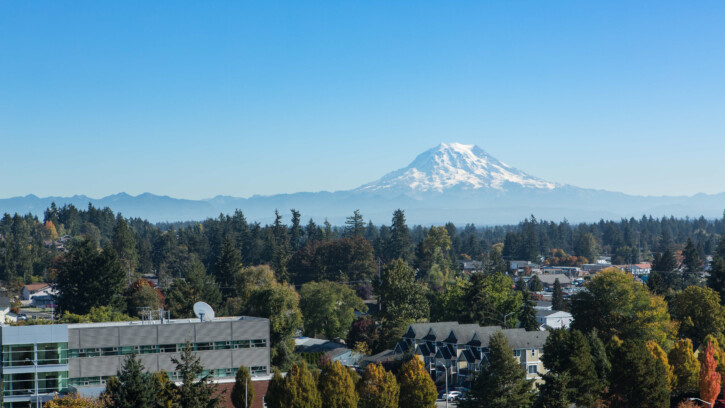 View of PLU campus from above with Mount Rainier in the background.