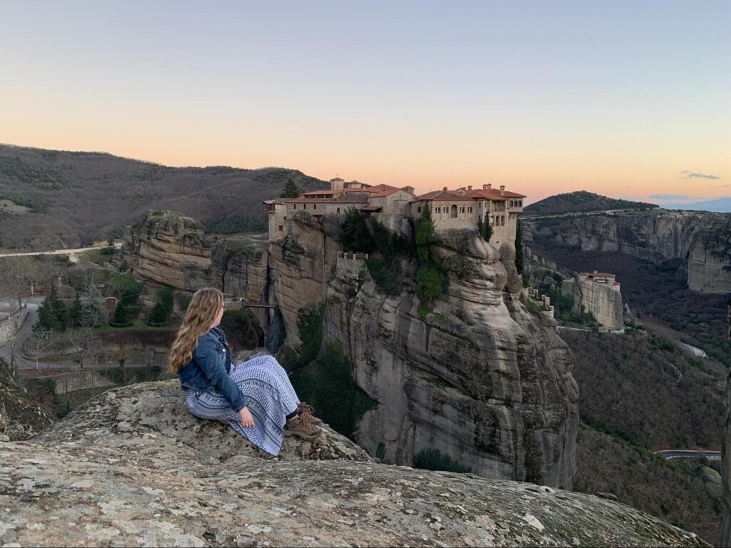 Student Anna Van Vleet looks out at a viewpoint in Meteora during her study away term.