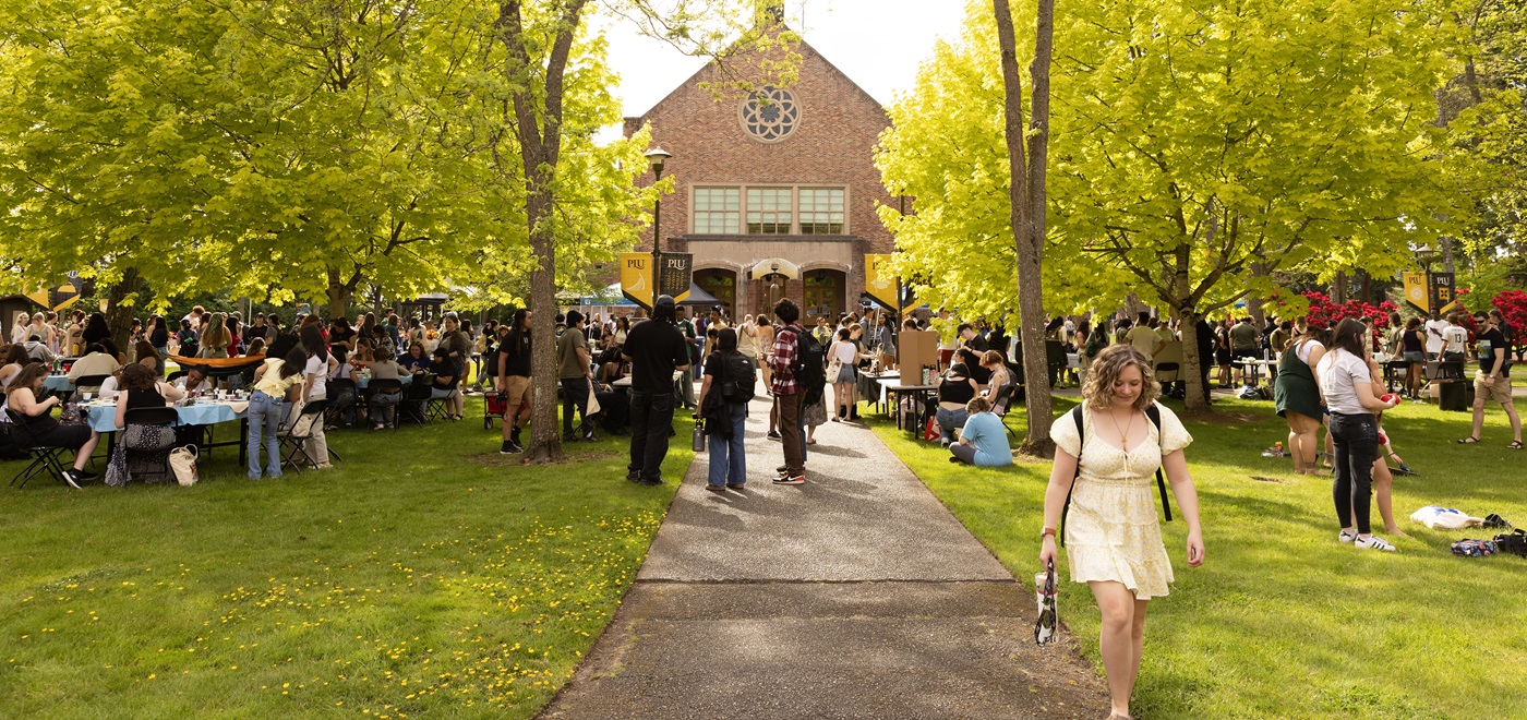 Students, faculty, and staff gather on Red Square on campus for the 4th Annual Studal Farmers Market, on a sunny spring day.