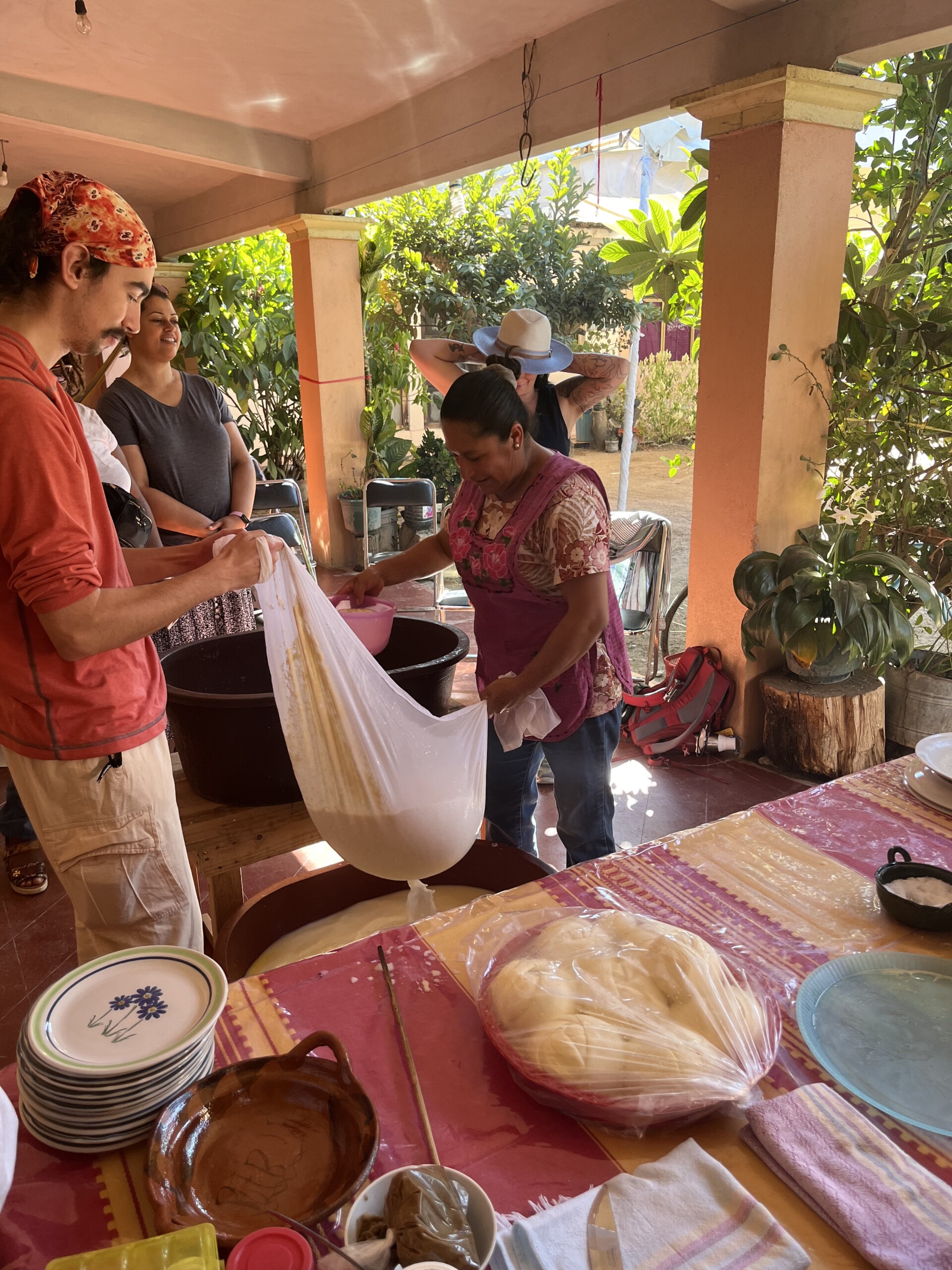 A students works with a local in Oaxaca, Mexico to learn how to make dough.