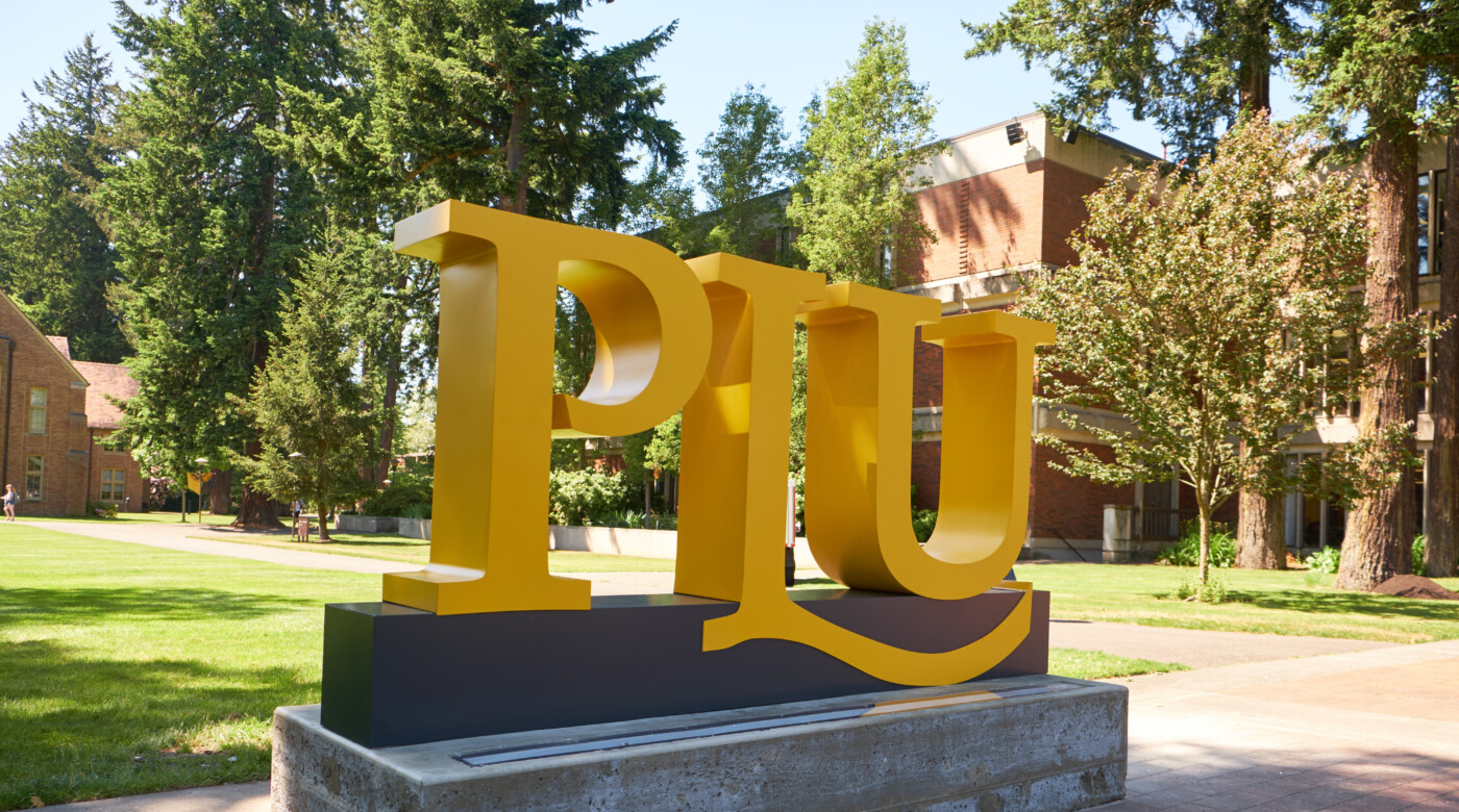 Photo of the yellow PLU sign on campus.