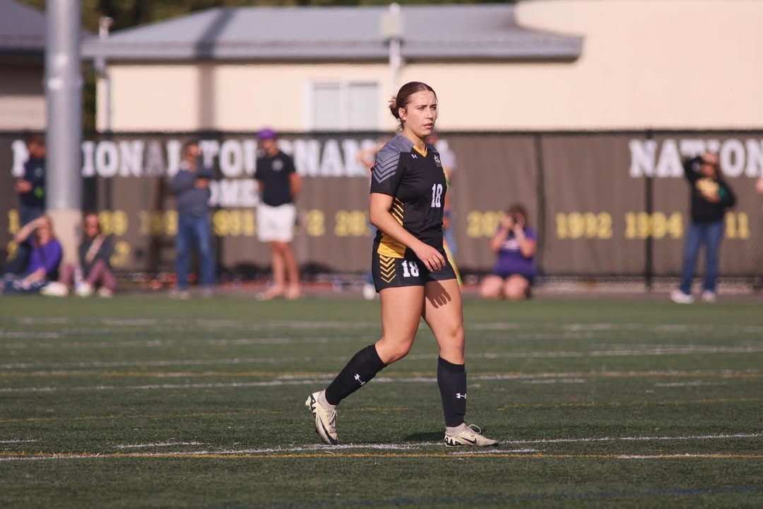 Carmen Kiewert playing soccer at east field PLU