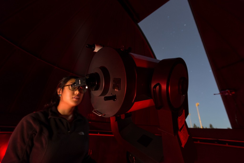 K Belmes at telescope, PLU John photo