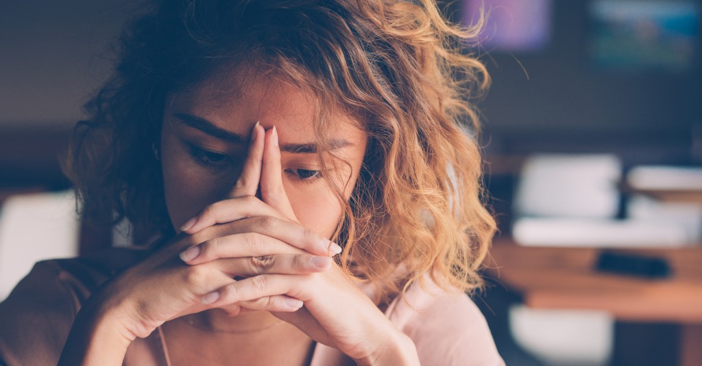 Tired Young Woman Leaning Head on Hands upset student