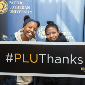 Thank a donor day at PLU, Feb. 28, 2019. (Photo: PLU/John Froschauer) Two students holding #PLUThanks sign