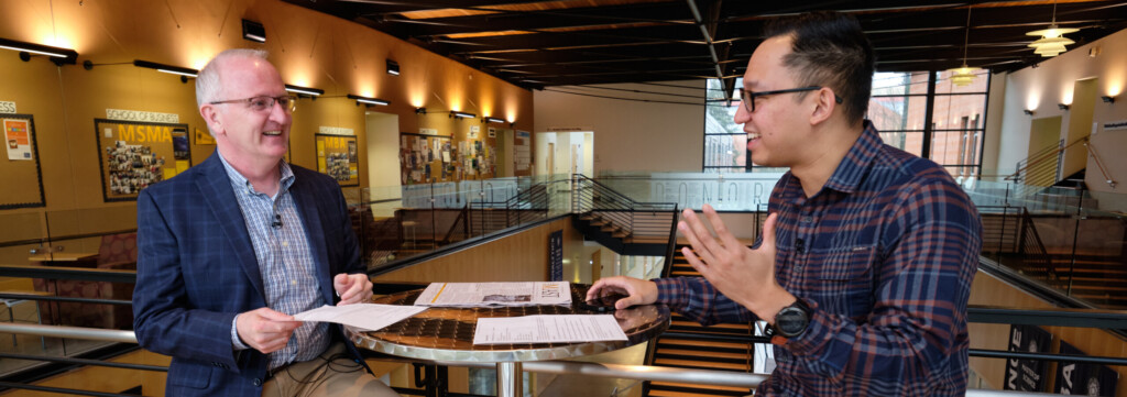 President Allan Belton talks with ASPLU President Todd Dizon in the Morken Center